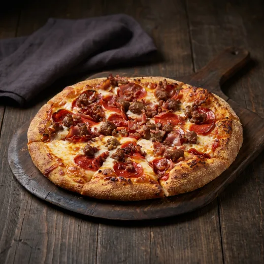 The Carnivore pizza — pepperoni, sausage, meatballs, smoked turkey ham and turkey bacon