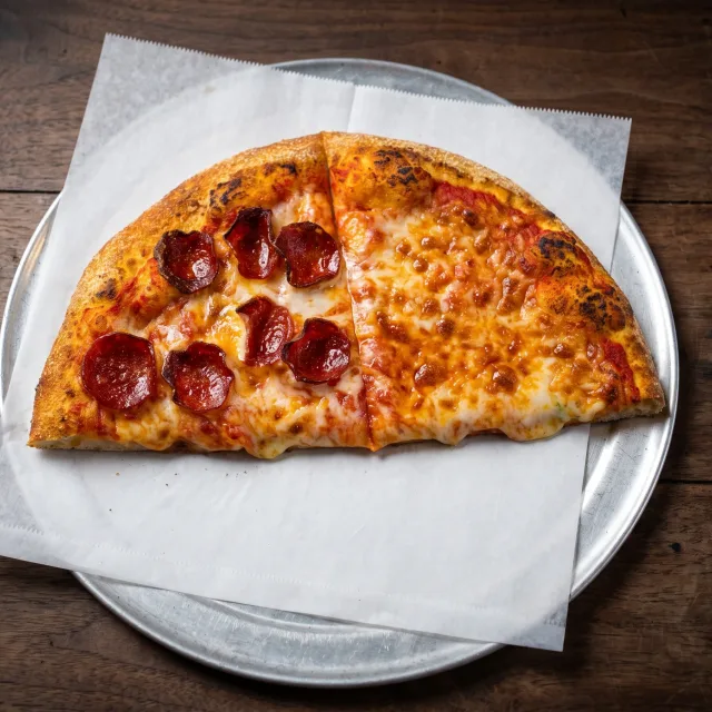 Two lunch-special slices on a tray — one pepperoni, one cheese